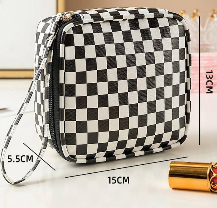 Private label travel checker makeup pouch bag with a sleek design, ideal for organizing cosmetics and toiletries.