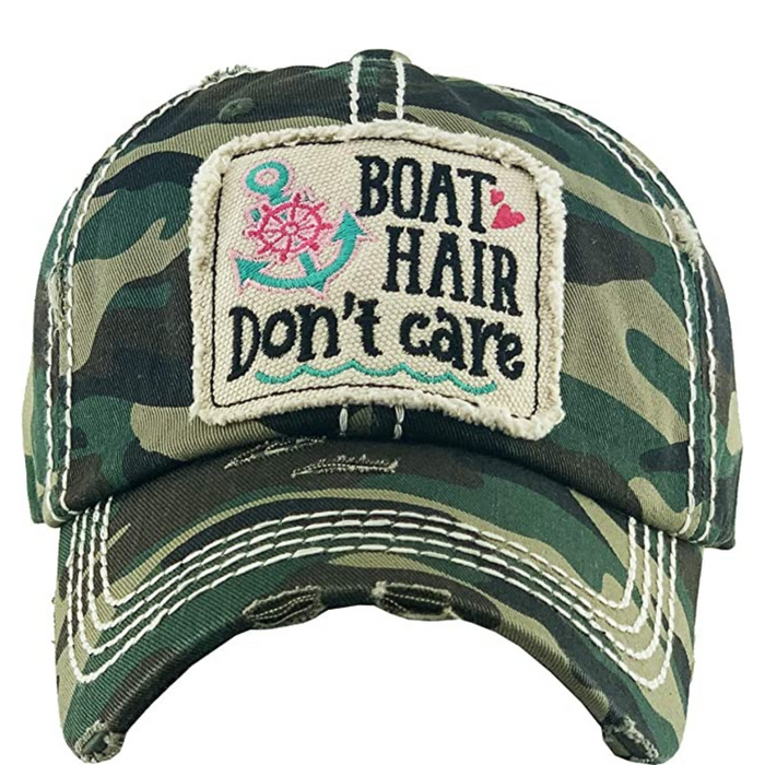 Vintage Funky Junque patch hat in camo with "Boat Hair Don't Care" embroidery, showcasing a relaxed, outdoor style.