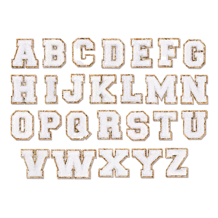 White glitter varsity initial letter sticker patch by Lil Darlings, featuring a sparkly decorative design for personalizing items.