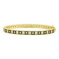Freida Rothman Windows of the City hinge bangle bracelet in black and gold with intricate design details.